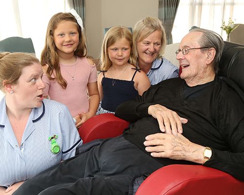 Resident enjoying talking to some young visitors