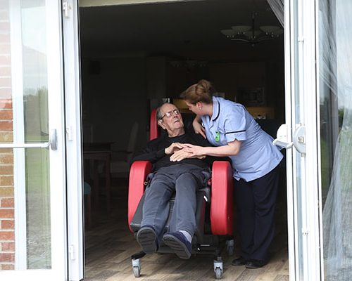A resident takes in some fresh air and the view at Elmhurst Care Home.